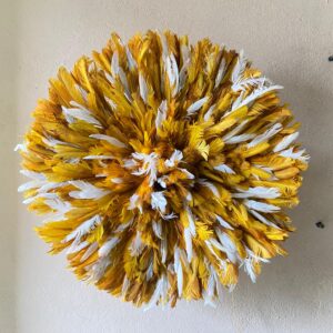 Mustard yellow juju hat with white feather speckle